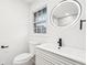 Modern bathroom features include a sleek vanity, LED mirror, and updated fixtures at 2401 Winshire Drive, Decatur, GA 30035
