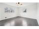 Bedroom with natural light, ceiling fan, and dark hardwood floors at 2401 Winshire Drive, Decatur, GA 30035