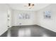 Bedroom with natural light, ceiling fan, and dark hardwood floors at 2401 Winshire Drive, Decatur, GA 30035