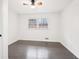 Bedroom features a ceiling fan, hardwood flooring, and large windows at 2401 Winshire Drive, Decatur, GA 30035