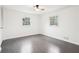 Neutral bedroom features hardwood flooring, a ceiling fan, and windows to allow for natural light at 2401 Winshire Drive, Decatur, GA 30035