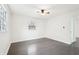 Light-filled bedroom with hardwood floors and a ceiling fan at 2401 Winshire Drive, Decatur, GA 30035