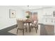 Cozy dining room with modern chandelier, decor, neutral walls, and view of the backyard at 2401 Winshire Drive, Decatur, GA 30035