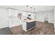 Beautiful kitchen featuring white cabinets, stainless appliances, an island with wood countertop and trendy backsplash at 2401 Winshire Drive, Decatur, GA 30035