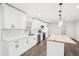 Bright kitchen features white cabinets, stainless steel appliances, wood floors, and a butcher block island at 2401 Winshire Drive, Decatur, GA 30035