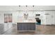 Stunning kitchen with white cabinets, stainless appliances, butcher block island, and views of the backyard at 2401 Winshire Drive, Decatur, GA 30035