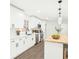 Bright kitchen features white cabinets, stainless steel appliances, wood floors, and a butcher block island at 2401 Winshire Drive, Decatur, GA 30035