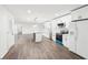 Beautiful kitchen with white cabinetry, stainless appliances, island with butcher block countertop, and open to living room at 2401 Winshire Drive, Decatur, GA 30035