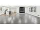 Bright, open-concept living room adjoining the updated kitchen, featuring a sleek fireplace at 2401 Winshire Drive, Decatur, GA 30035