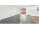 Bright open-concept floor plan features hardwood floors and access to the kitchen with white cabinets at 2401 Winshire Drive, Decatur, GA 30035