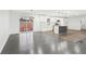Bright open-concept living room and kitchen with hardwood floors, modern cabinets, and island at 2401 Winshire Drive, Decatur, GA 30035
