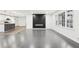 Spacious living room showcases the fireplace feature wall and adjoins the updated kitchen at 2401 Winshire Drive, Decatur, GA 30035