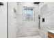 Walk-in shower with tile walls and window at 2401 Winshire Drive, Decatur, GA 30035