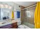 Bright bathroom with tile surround shower and granite countertop vanity at 2479 Peachtree Ne St # 1414, Atlanta, GA 30305