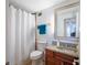 Cozy bathroom with granite countertop vanity and shower with glass doors at 2479 Peachtree Ne St # 1414, Atlanta, GA 30305