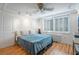 Bedroom featuring hardwood floors, white walls, and shuttered windows at 2479 Peachtree Ne St # 1414, Atlanta, GA 30305