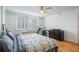 Bedroom featuring shuttered window, hardwood flooring, and ceiling fan at 2479 Peachtree Ne St # 1414, Atlanta, GA 30305