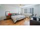 Bedroom featuring hardwood floors, white walls, and shuttered windows at 2479 Peachtree Ne St # 1414, Atlanta, GA 30305