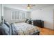 Bedroom featuring hardwood floors, white walls, and shuttered windows at 2479 Peachtree Ne St # 1414, Atlanta, GA 30305
