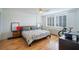 Bright bedroom features shutters and hardwood flooring at 2479 Peachtree Ne St # 1414, Atlanta, GA 30305