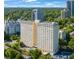 Stunning high-rise building with pool, beautiful landscaping, and scenic views of the surrounding city and lush greenery at 2479 Peachtree Ne St # 1414, Atlanta, GA 30305
