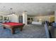 Open game room includes a pool table, lounge area, and dining sets at 2479 Peachtree Ne St # 1414, Atlanta, GA 30305