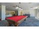 Spacious community game room featuring a pool table, seating and natural lighting at 2479 Peachtree Ne St # 1414, Atlanta, GA 30305