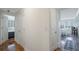 Bright hallway featuring wood floors and crisp white doors leading to bedroom and sunlit dining area, creating an inviting flow at 2479 Peachtree Ne St # 1414, Atlanta, GA 30305