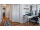 Home office and hallway featuring hardwood floors, built in shelves, and a comfortable workspace at 2479 Peachtree Ne St # 1414, Atlanta, GA 30305