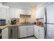 Bright kitchen featuring white cabinets and granite countertops at 2479 Peachtree Ne St # 1414, Atlanta, GA 30305