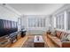 Bright living room featuring hardwood floors, neutral walls, and large windows at 2479 Peachtree Ne St # 1414, Atlanta, GA 30305