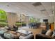 Community lounge area with windows, seating, long dining table, and a bar for entertaining at 2479 Peachtree Ne St # 1414, Atlanta, GA 30305