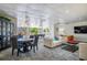 Bright lounge area with sofas, dining table, and pool table for community residents at 2479 Peachtree Ne St # 1414, Atlanta, GA 30305