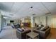 Large lounge area with plush seating, a long dining table, a wet bar, and an exit for easy access at 2479 Peachtree Ne St # 1414, Atlanta, GA 30305