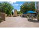 Open-air patio with multiple seating areas under umbrellas, planters, and a built-in grill perfect for entertaining at 2479 Peachtree Ne St # 1414, Atlanta, GA 30305