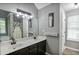 Spacious bathroom with a double sink vanity and decorative touches at 405 Settlers Ridge Ln, Hiram, GA 30141