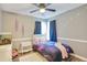 Cozy bedroom with galaxy bedding, ceiling fan, and whimsical decor at 405 Settlers Ridge Ln, Hiram, GA 30141