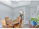 A dining room with a round wooden table and four chairs is situated next to the kitchen area at 405 Settlers Ridge Ln, Hiram, GA 30141