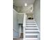 Inviting entryway showcasing staircase that leads to a spacious living room with fireplace at 405 Settlers Ridge Ln, Hiram, GA 30141