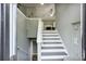 Inviting entryway showcasing staircase that leads to a spacious living room with fireplace at 405 Settlers Ridge Ln, Hiram, GA 30141