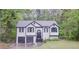 Charming two-story home featuring a well-maintained yard and a convenient two-car garage at 405 Settlers Ridge Ln, Hiram, GA 30141