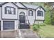 Stylish home entrance with a decorative window above the black front door and black trim at 405 Settlers Ridge Ln, Hiram, GA 30141