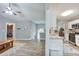Open concept living space with kitchen view, hardwood floors, and ample natural light at 405 Settlers Ridge Ln, Hiram, GA 30141