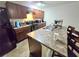 Kitchen with stainless steel appliances, granite countertops, a breakfast bar, and seating for three at 2365 Hackamore Dr, Atlanta, GA 30349