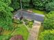 An aerial shot of a home with well-maintained landscaping and mature trees on a beautiful lot at 4293 Smithsonia Dr, Tucker, GA 30084