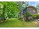 Brick home with lush green lawn and mature trees at 4293 Smithsonia Dr, Tucker, GA 30084