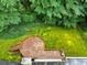 Aerial view of lush backyard with deck nestled among mature trees, providing privacy and a serene outdoor space at 4293 Smithsonia Dr, Tucker, GA 30084