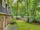 The backyard features a small stream and wooded scenery at 4293 Smithsonia Dr, Tucker, GA 30084