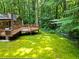 A spacious wooden deck overlooks a lush, green backyard, offering a serene outdoor living space at 4293 Smithsonia Dr, Tucker, GA 30084