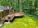 An outdoor deck with a grill, great for entertaining or relaxing in the private backyard at 4293 Smithsonia Dr, Tucker, GA 30084